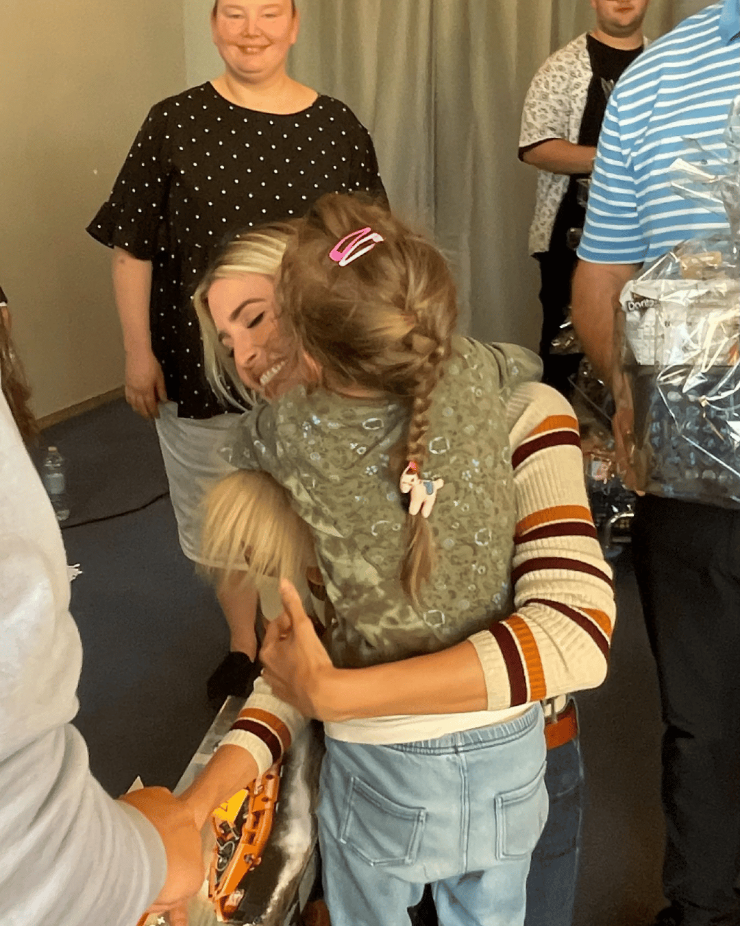 Ivanka Trump hugging a young girl.