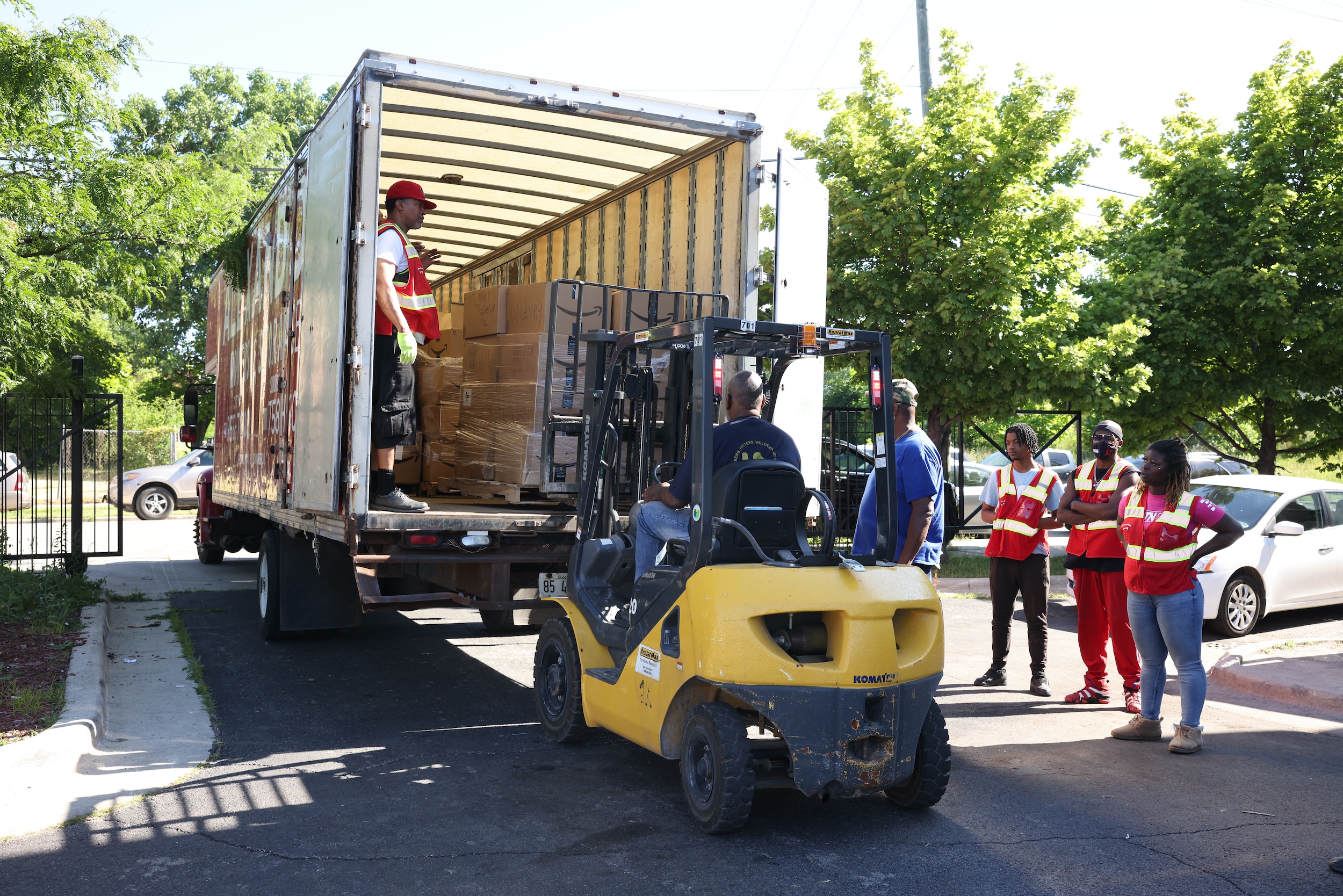 Truck Unloading goods for people.