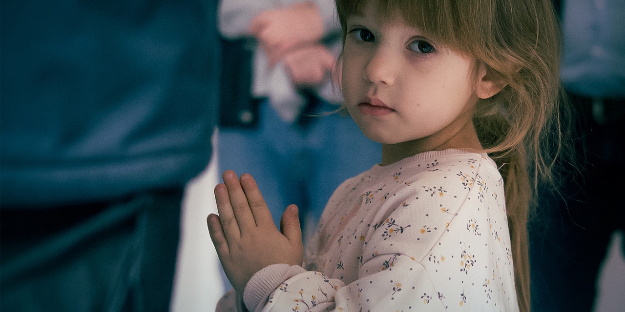 Little Girl Ukrainian refugee in church.